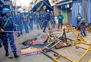 Security personnel at the site of clashes in Aligarh on Sunday.(Photo: PTI) Security personnel at the site of clashes in Aligarh on Sunday.(Photo: PTI)