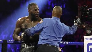 Deontay Wilder is stopped by Referee Kenny Bayless during his fight against Tyson Fury after Wilder's corner throw a towel into the ring.(REUTERS) Deontay Wilder is stopped by Referee Kenny Bayless during his fight against Tyson Fury after Wilder's corner throw a towel into the ring.(REUTERS)
