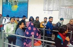 Passengers lined up outside the closed ticket counter at the Mohali railway station in the wee hours of Wednesday.(HT PHOTO)