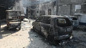 The burnt out wreckage of cars and other vehicles near a petrol pump after clashes between opposing groups over the Citizenship Amendment Act (CAA) at Bhajanpura in New Delhi, India, on Wednesday, February 26, 2020.(Biplov Bhuyan/HT PHOTO) The burnt out wreckage of cars and other vehicles near a petrol pump after clashes between opposing groups over the Citizenship Amendment Act (CAA) at Bhajanpura in New Delhi, India, on Wednesday, February 26, 2020.(Biplov Bhuyan/HT PHOTO)