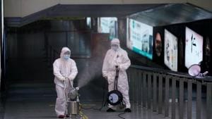 Workers with sanitizing equipment disinfect at the Shanghai railway station in Shanghai, China, as the country is hit by an outbreak of a new coronavirus.(REUTERS)