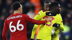 Liverpool's Trent Alexander-Arnold clashes with Watford's Ismaila Sarr and Abdoulaye Doucoure.(REUTERS) Liverpool's Trent Alexander-Arnold clashes with Watford's Ismaila Sarr and Abdoulaye Doucoure.(REUTERS)