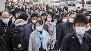 Morning commuters cross a road in the Shinjuku district of Tokyo, Japan.(Bloomberg) Morning commuters cross a road in the Shinjuku district of Tokyo, Japan.(Bloomberg)