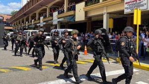 Armed police arrive at the V-Mall where gunshots rang out inside, in Manila, Philippines, Monday, March 2, 2020.(AP) Armed police arrive at the V-Mall where gunshots rang out inside, in Manila, Philippines, Monday, March 2, 2020.(AP)