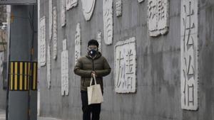 A resident wearing a mask walks outside a closed school with a mural depicting keywords including at right “Rule of law” in Beijing. Chinese schools turning to online learning during a virus outbreak are running into the country’s ubiquitous and often arbitrary internet censorship. (AP Photo/Ng Han Guan) A resident wearing a mask walks outside a closed school with a mural depicting keywords including at right “Rule of law” in Beijing. Chinese schools turning to online learning during a virus outbreak are running into the country’s ubiquitous and often arbitrary internet censorship. (AP Photo/Ng Han Guan)