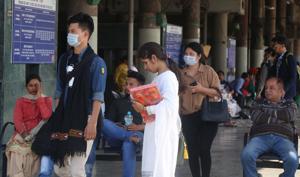 TAKING NO CHANCES: Passengers wearing masks as a precaution, at the ISBT in Sector 17, Chandigarh, on Wednesday.(SANJEEV SHARMA/HT) TAKING NO CHANCES: Passengers wearing masks as a precaution, at the ISBT in Sector 17, Chandigarh, on Wednesday.(SANJEEV SHARMA/HT)
