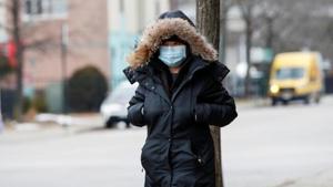 A woman wears a mask in Chinatown following the outbreak of the novel coronavirus in Chicago, Illinois, United States.(Reuters Photo) A woman wears a mask in Chinatown following the outbreak of the novel coronavirus in Chicago, Illinois, United States.(Reuters Photo)