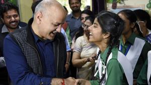 Delhi Deputy Chief Minister Manish Sisodia interacts with students during attending PTM at riots affected government schools, in North East Delhi on Wednesday.(ANI) Delhi Deputy Chief Minister Manish Sisodia interacts with students during attending PTM at riots affected government schools, in North East Delhi on Wednesday.(ANI)