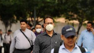 People are seen wearing protective masks following multiple positive cases of coronavirus in the country.(HT File Photo) People are seen wearing protective masks following multiple positive cases of coronavirus in the country.(HT File Photo)
