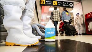 Workers spray sanitiser at the El Salvador International Airport Saint Oscar Romero y Galdamez over coronavirus fears, in San Salvador, El Salvador, which has no reported cases of coronavirus, March 4, 2020.(Reuters photo for representation) Workers spray sanitiser at the El Salvador International Airport Saint Oscar Romero y Galdamez over coronavirus fears, in San Salvador, El Salvador, which has no reported cases of coronavirus, March 4, 2020.(Reuters photo for representation)