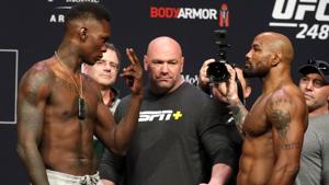 UFC middleweight champion Israel Adesanya, left, of Nigeria, and challenger Yoel Romero, of Cuba, face off during a ceremonial weigh-in for UFC 248 at T-Mobile Arena.(AP) UFC middleweight champion Israel Adesanya, left, of Nigeria, and challenger Yoel Romero, of Cuba, face off during a ceremonial weigh-in for UFC 248 at T-Mobile Arena.(AP)
