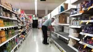 A picture of an elderly man staring at an empty rack that earlier was stacked with toilet paper rolls in a store abroad has gone viral on the social media.(Justine Bowers/official Facebook) A picture of an elderly man staring at an empty rack that earlier was stacked with toilet paper rolls in a store abroad has gone viral on the social media.(Justine Bowers/official Facebook)