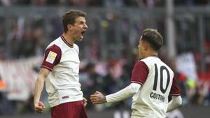 Bayern's Thomas Mueller, left, celebrates with Philippe Coutinho after scoring his side's first goal during the German Bundesliga soccer match between FC Bayern Munich and FC Augsburg in Munich(AP) Bayern's Thomas Mueller, left, celebrates with Philippe Coutinho after scoring his side's first goal during the German Bundesliga soccer match between FC Bayern Munich and FC Augsburg in Munich(AP)