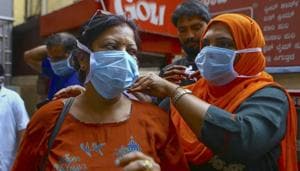Social activists distribute masks in wake of the deadly coronavirus, at a metro station in Bengaluru.(PTI) Social activists distribute masks in wake of the deadly coronavirus, at a metro station in Bengaluru.(PTI)