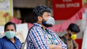 People wearing protective masks wait to board a bus at a terminal amid coronavirus fears, in Kerala’s Kochi on March 11.(Reuters Photo) People wearing protective masks wait to board a bus at a terminal amid coronavirus fears, in Kerala’s Kochi on March 11.(Reuters Photo)