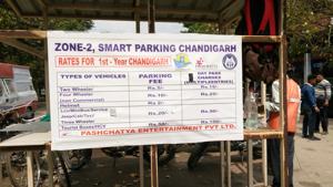 This board at a parking lot in Sector 22, Chandigarh, does not list the provision for 10-minute free parking. The facility is available for any commuter entering the lot to pick or drop passengers.(Ht Photo) This board at a parking lot in Sector 22, Chandigarh, does not list the provision for 10-minute free parking. The facility is available for any commuter entering the lot to pick or drop passengers.(Ht Photo)