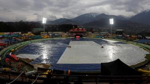 Cricket - India v South Africa - First ODI - Himachal Pradesh Cricket Association Stadium, Dharamsala, India - March 12, 2020 General view inside the stadium as the pitch is covered during the rain delay to the start of the match(REUTERS) Cricket - India v South Africa - First ODI - Himachal Pradesh Cricket Association Stadium, Dharamsala, India - March 12, 2020 General view inside the stadium as the pitch is covered during the rain delay to the start of the match(REUTERS)