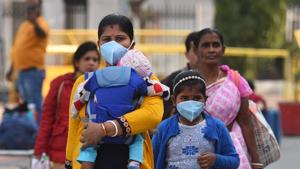 People are seen wearing protective face masks as a precautionary measure against coronavirus, at New Delhi Railway Station on Thursday.(Sanchit Khanna/HT Photo) People are seen wearing protective face masks as a precautionary measure against coronavirus, at New Delhi Railway Station on Thursday.(Sanchit Khanna/HT Photo)