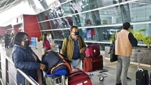 People seen wearing protective masks as a precautionary measure amid rising coronavirus scare, at Indira Gandhi International (IGI) Airport in New Delhi on Friday.(Sanjeev Verma/HT Photo) People seen wearing protective masks as a precautionary measure amid rising coronavirus scare, at Indira Gandhi International (IGI) Airport in New Delhi on Friday.(Sanjeev Verma/HT Photo)