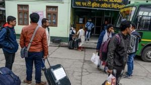 Travellers stand in front of the Sikkim Nationalised Transport office in Siliguri as they wait for transport following a ban put by the Sikkim government on all foreign tourists due to coronavirus outbreak, March 6, 2020.(AFP)
