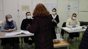 Masked voting volunteers face a woman voting for local elections Sunday March 15, 2020 in Paris. France is holding nationwide elections Sunday to choose all of its mayors and other local leaders despite a crackdown on public gatherings because of the new virus. For most people, the new coronavirus causes only mild or moderate symptoms. For some it can cause more severe illness.(AP) Masked voting volunteers face a woman voting for local elections Sunday March 15, 2020 in Paris. France is holding nationwide elections Sunday to choose all of its mayors and other local leaders despite a crackdown on public gatherings because of the new virus. For most people, the new coronavirus causes only mild or moderate symptoms. For some it can cause more severe illness.(AP)