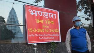 A banner informing devotees about the closure of community kitchen at the Mata Mansa Devi temple on Sunday.(HT PHOTO) A banner informing devotees about the closure of community kitchen at the Mata Mansa Devi temple on Sunday.(HT PHOTO)