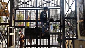 During the violence, several Hindu and Muslim pockets in riot-affected localities were separated by temporary blockades made of broken furniture, wooden planks, tin sheets, debris of destroyed houses and shops. Several have now been replaced by permanent iron gates.(Abhishek Dey/HT) During the violence, several Hindu and Muslim pockets in riot-affected localities were separated by temporary blockades made of broken furniture, wooden planks, tin sheets, debris of destroyed houses and shops. Several have now been replaced by permanent iron gates.(Abhishek Dey/HT)