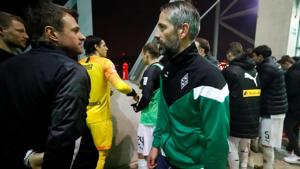 Borussia Moenchengladbach coach Marco Rose looks on as the players celebrate in front of their fans.(REUTERS) Borussia Moenchengladbach coach Marco Rose looks on as the players celebrate in front of their fans.(REUTERS)