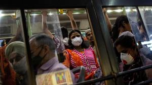 Commuters wearing protective masks as a precaution against the spread of coronavirus disease Covid-19, travel in a crowded bus in New Delhi on March 18.(Reuters Photo) Commuters wearing protective masks as a precaution against the spread of coronavirus disease Covid-19, travel in a crowded bus in New Delhi on March 18.(Reuters Photo)