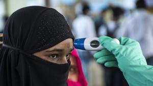 Mumbai, India - March 20, 2020: Railway Medical staff check temperature of the passengers ahead of Coronavirus (COVID19) threat, at Lokmanya Tilak Terminus in Mumbai, India, on Friday, March 20, 2020. (Photo by Pratik Chorge/Hindustan Times)(Pratik Chorge/HT Photo) Mumbai, India - March 20, 2020: Railway Medical staff check temperature of the passengers ahead of Coronavirus (COVID19) threat, at Lokmanya Tilak Terminus in Mumbai, India, on Friday, March 20, 2020. (Photo by Pratik Chorge/Hindustan Times)(Pratik Chorge/HT Photo)