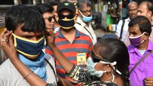 An NGO worker distributes masks to bus drivers and conductors, Kolkata, West Bengal, March 19, 2020(Samir Jana/Hindustan Times) An NGO worker distributes masks to bus drivers and conductors, Kolkata, West Bengal, March 19, 2020(Samir Jana/Hindustan Times)
