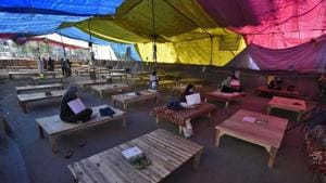 At Shaheen Bagh, protesters symbolically left their slippers on wooden beds on Sunday, March 22, 2020.(Burhaan Kinu/HT PHOTO)