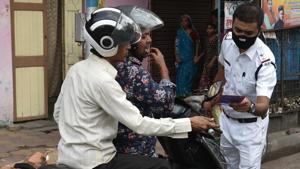 A policeman check the identity of people out during lockdown due to coronavirus outbreak, in Kolkata, West Bengal, on Tuesday, March 24, 2020.(Samir Jana / HT Photo) A policeman check the identity of people out during lockdown due to coronavirus outbreak, in Kolkata, West Bengal, on Tuesday, March 24, 2020.(Samir Jana / HT Photo)