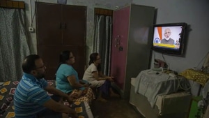 A family watches Prime Minister Narendra Modi address the nation in a televised speech about COVID-19 situation, in Gauhati.(AP) A family watches Prime Minister Narendra Modi address the nation in a televised speech about COVID-19 situation, in Gauhati.(AP)