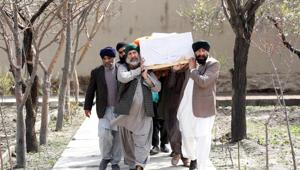 Afghan Sikh men carry a coffin of one of the victims who was killed during the attack at a Kabul gurdwara on March 25, 2020.(REUTERS) Afghan Sikh men carry a coffin of one of the victims who was killed during the attack at a Kabul gurdwara on March 25, 2020.(REUTERS)