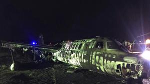 In this handout photo provided by the Manila International Airport Authority (MIAA) Media Affairs Office, the remains of a Lion Air, West Wind 24 aircraft lies along the runway after it caught fire during take off at Manila's International Airport in Philippines late Sunday March 29, 2020.(AP) In this handout photo provided by the Manila International Airport Authority (MIAA) Media Affairs Office, the remains of a Lion Air, West Wind 24 aircraft lies along the runway after it caught fire during take off at Manila's International Airport in Philippines late Sunday March 29, 2020.(AP)
