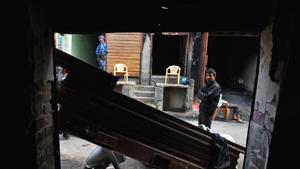 A man looks into a building burnt in the riots across North East Delhi, at Shiv Vihar.(Sanchit Khanna/HT PHOTO) A man looks into a building burnt in the riots across North East Delhi, at Shiv Vihar.(Sanchit Khanna/HT PHOTO)
