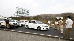 Police officials from the Rajgad police station which comes under the Pune rural police department, have been guarding the check post. According to officials, there are 30 police personnel, three officials and a senior police inspector working in shifts at this check post.(Rahul Raut/HT PHOTO) Police officials from the Rajgad police station which comes under the Pune rural police department, have been guarding the check post. According to officials, there are 30 police personnel, three officials and a senior police inspector working in shifts at this check post.(Rahul Raut/HT PHOTO)
