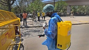 An NGO worker spraying disinfectant on a police barricade on day 9 of the 21-day nationwide lockdown to check the spread of coronavirus, at Yamuna Pushta, Nigambodh Ghat in New Delhi on Thursday.(Sanchit Khanna/HT PHOTO) An NGO worker spraying disinfectant on a police barricade on day 9 of the 21-day nationwide lockdown to check the spread of coronavirus, at Yamuna Pushta, Nigambodh Ghat in New Delhi on Thursday.(Sanchit Khanna/HT PHOTO)