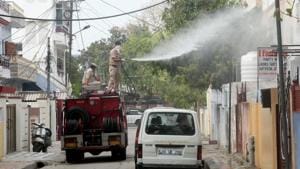 Municipal workers spray disinfectant to sanitise an area in Jaipur to curb the spread of coronavirus on March 31.(Himanshu Vyas/HT Photo) Municipal workers spray disinfectant to sanitise an area in Jaipur to curb the spread of coronavirus on March 31.(Himanshu Vyas/HT Photo)