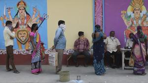 People maintain social distance in a queue to receive free rice distributed at a government store during lockdown to prevent the spread of new coronavirus in Hyderabad, on April 2.(AP Photo) People maintain social distance in a queue to receive free rice distributed at a government store during lockdown to prevent the spread of new coronavirus in Hyderabad, on April 2.(AP Photo)