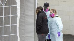 First responders bring a patient into the triage tent at the Verdun Hospital, Thursday, April 2, 2020 in Montreal. Canada has received a shipments totalling nearly 11 million face masks and has announced that it will be leveraging Amazon Canada’s distribution network to get urgently needed medical material to cities and provinces across the nation.(AP) First responders bring a patient into the triage tent at the Verdun Hospital, Thursday, April 2, 2020 in Montreal. Canada has received a shipments totalling nearly 11 million face masks and has announced that it will be leveraging Amazon Canada’s distribution network to get urgently needed medical material to cities and provinces across the nation.(AP)
