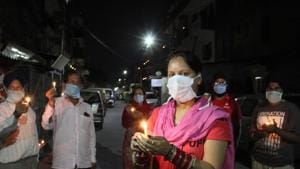 DEFEATING THE PURPOSE: Residents gathered on a street, giving two hoots to the PM’s appeal for social distancing, during the candlelight vigil against coronavirus in Mohali on Sunday.(gurminder singh/ht) DEFEATING THE PURPOSE: Residents gathered on a street, giving two hoots to the PM’s appeal for social distancing, during the candlelight vigil against coronavirus in Mohali on Sunday.(gurminder singh/ht)