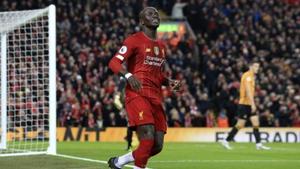 Liverpool's Sadio Mane smiles after scoring the opening goal during the English Premier League soccer match between Liverpool and Wolverhampton Wanderers at Anfield Stadium, Liverpool, England, Sunday Dec. 29, 2019.(AP) Liverpool's Sadio Mane smiles after scoring the opening goal during the English Premier League soccer match between Liverpool and Wolverhampton Wanderers at Anfield Stadium, Liverpool, England, Sunday Dec. 29, 2019.(AP)