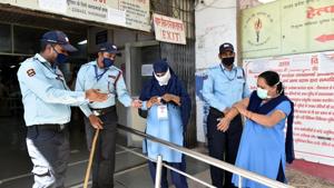 Security personnel seen using hand sanitiser.(Dheeraj Dhawan / Hindustan Times) Security personnel seen using hand sanitiser.(Dheeraj Dhawan / Hindustan Times)