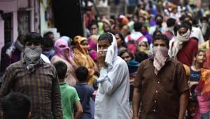 BPL card holders wait to collect ration under the Delhi government PDS scheme, on day fourteen of the 21-day nationwide lockdown to curb the spread of coronavirus, at Moti Lal Nehru Camp, Munirka Village, in New Delhi, India, on Tuesday, April 7, 2020.(Sanjeev Verma/HT PHOTO) BPL card holders wait to collect ration under the Delhi government PDS scheme, on day fourteen of the 21-day nationwide lockdown to curb the spread of coronavirus, at Moti Lal Nehru Camp, Munirka Village, in New Delhi, India, on Tuesday, April 7, 2020.(Sanjeev Verma/HT PHOTO)