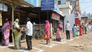 People maintain social distancing while standing in a queue outside a bank, in Maharashtra’s Karad, on Wednesday.(PTI Photo) People maintain social distancing while standing in a queue outside a bank, in Maharashtra’s Karad, on Wednesday.(PTI Photo)