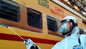 A Railway worker spraying disinfectant on a Covid-19 isolation coach during a nationwide lockdown as a preventive measure against the coronavirus.(ANI PHOTO.) A Railway worker spraying disinfectant on a Covid-19 isolation coach during a nationwide lockdown as a preventive measure against the coronavirus.(ANI PHOTO.)