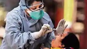 A doctor wearing a protective gear takes a swab from a woman to test for coronavirus disease (COVID-19), in Dharavi, one of Asia’s largest slums, in Mumbai, April 9, 2020.(Reuters) A doctor wearing a protective gear takes a swab from a woman to test for coronavirus disease (COVID-19), in Dharavi, one of Asia’s largest slums, in Mumbai, April 9, 2020.(Reuters)