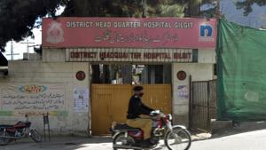 A police officer rides past a closed entrance of the District Head Quarter Hospital, where a doctor who screened suspected coronavirus disease (Covid-19) patients tested positive and died on Sunday, in Gilgit.(Reuters) A police officer rides past a closed entrance of the District Head Quarter Hospital, where a doctor who screened suspected coronavirus disease (Covid-19) patients tested positive and died on Sunday, in Gilgit.(Reuters)